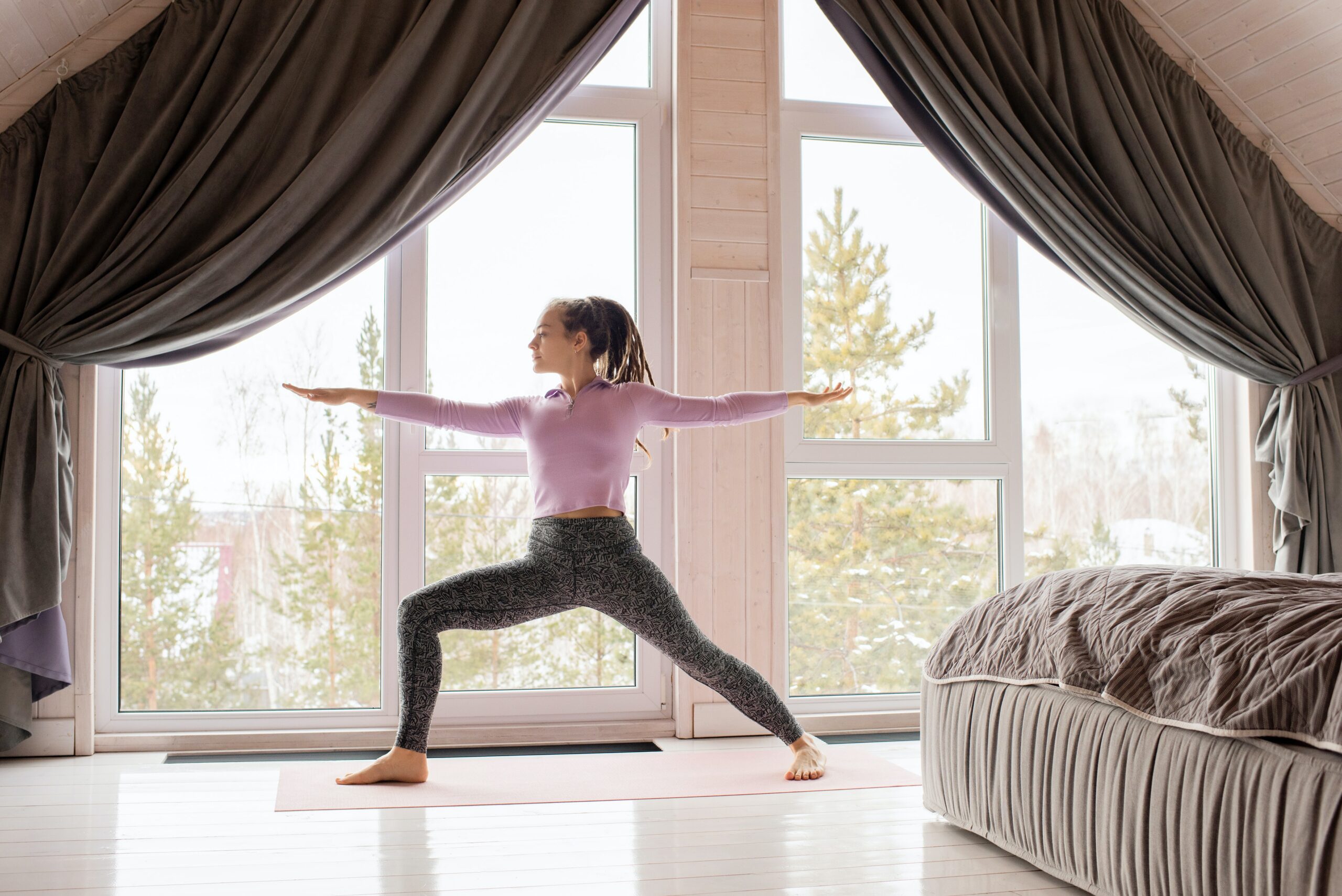 photo of woman doing yoga for blog about 5 ways to stay active during the winter